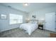 Inviting bedroom with a plush bed, decorative pillows, soft lighting, and a window with blinds at 302 Fiddleback Dr, Summerville, SC 29486