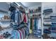 Organized walk-in closet featuring ample storage with shelves, hanging racks, and compartments for various clothing items at 302 Fiddleback Dr, Summerville, SC 29486
