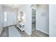 Welcoming entryway featuring wood floors, white trim, console table and rug at 302 Fiddleback Dr, Summerville, SC 29486