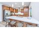 Bright kitchen boasts stainless appliances, island with seating, and ample cabinetry at 302 Fiddleback Dr, Summerville, SC 29486