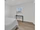 Bedroom with light wood floors, white walls, and a window providing natural light at 303 Gippy Dr, Summerville, SC 29486