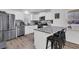 Modern kitchen features white cabinets, stainless steel appliances, granite countertops and bar stool seating at 303 Gippy Dr, Summerville, SC 29486