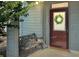 Charming front door with wreath, bench, and ample sunlight at 3104 Mariners Way, Moncks Corner, SC 29461