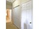 Hallway with white doors, neutral walls, and carpeted floors leads to other rooms at 3104 Mariners Way, Moncks Corner, SC 29461