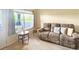 Cozy living room featuring a plush sofa and ample natural light, perfect for relaxation at 3104 Mariners Way, Moncks Corner, SC 29461
