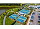 Stunning aerial view of the community with tennis courts, lake, and lush greenery at 312 Clearpath Dr, Summerville, SC 29486