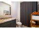 Charming bathroom featuring a granite vanity, modern fixtures, and stylish shower curtain at 312 Clearpath Dr, Summerville, SC 29486