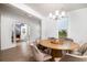 Elegant dining room featuring a round table with seating and a view of the neighborhood at 312 Clearpath Dr, Summerville, SC 29486