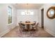 Cozy dining room with a round table, modern chandelier, and stylish decor at 312 Clearpath Dr, Summerville, SC 29486
