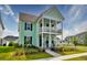 Charming two-story home showcasing a double porch, manicured lawn, and attractive curb appeal with great neighborhood views at 312 Clearpath Dr, Summerville, SC 29486