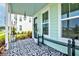 Inviting front porch with patterned rug, seating, decor, and stylish black trim offering a charming welcome at 312 Clearpath Dr, Summerville, SC 29486