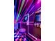 Vibrant game room with classic arcade machines, neon accents, and checkered flooring for an exciting entertainment space at 312 Clearpath Dr, Summerville, SC 29486