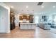 Open-concept kitchen featuring stainless steel appliances, large center island, and hardwood floors, seamlessly connecting to the living space at 312 Clearpath Dr, Summerville, SC 29486