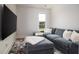 Comfortable living room with a large sectional sofa, plush rug, and modern entertainment setup at 312 Clearpath Dr, Summerville, SC 29486