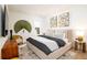 Serene main bedroom with stylish decor, including unique artwork and cozy bedding at 312 Clearpath Dr, Summerville, SC 29486