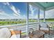 Comfortable screened-in porch offering scenic views of the pond and neighboring homes at 312 Clearpath Dr, Summerville, SC 29486
