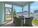 Inviting screened porch with stylish wicker furniture and views of the manicured lawn at 312 Clearpath Dr, Summerville, SC 29486