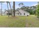 Expansive backyard of a single story home, perfect for and pets, featuring a well-kept lawn at 3214 Pinewood Dr, Ladson, SC 29456
