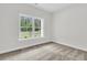 Neutral bedroom with a window view of trees, plush carpet and base trim at 3214 Pinewood Dr, Ladson, SC 29456