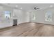 Well-lit kitchen featuring stainless steel appliances, quartz countertops, and vinyl floors at 3214 Pinewood Dr, Ladson, SC 29456