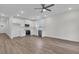 Open-concept kitchen features stainless steel appliances, sleek white cabinets, and a large island at 3214 Pinewood Dr, Ladson, SC 29456
