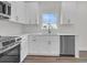 Well-lit kitchen featuring stainless steel appliances, quartz countertops and white cabinets at 3214 Pinewood Dr, Ladson, SC 29456