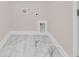 Laundry room features marble floors and utility connections at 3214 Pinewood Dr, Ladson, SC 29456