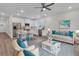 Open-concept living area with a modern kitchen, dining space, and a comfortable seating area at 3214 Pinewood Dr, Ladson, SC 29456