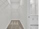 Spacious walk-in closet with wire shelving, carpet, and adjacent bathroom at 3214 Pinewood Dr, Ladson, SC 29456
