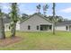 Back exterior view of the home and its back yard at 3218 Pinewood Dr, Ladson, SC 29456