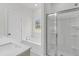 Bright bathroom featuring a white garden tub, shower, vanity with white countertops, and ample natural light at 3218 Pinewood Dr, Ladson, SC 29456
