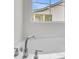 Close-up of new bathtub hardware and a window offering a view of the home's exterior at 3218 Pinewood Dr, Ladson, SC 29456