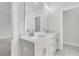 Well-lit bathroom featuring a double sink vanity with bright white cabinets, light countertops, and brushed-nickel hardware at 3218 Pinewood Dr, Ladson, SC 29456