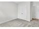 Bright bedroom featuring plush carpeting, white trim, and a double door closet for storage at 3218 Pinewood Dr, Ladson, SC 29456