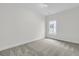 Carpeted bedroom with a single window letting in natural light at 3218 Pinewood Dr, Ladson, SC 29456