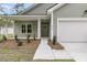 Close-up of the house entrance, showcasing well-kept lawn and landscaping at 3218 Pinewood Dr, Ladson, SC 29456