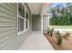 A side-view of the house and landscaped lawn at 3218 Pinewood Dr, Ladson, SC 29456