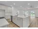 Open concept kitchen featuring stainless appliances, quartz island countertop and modern cabinetry at 3218 Pinewood Dr, Ladson, SC 29456