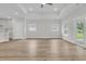 Spacious living room with neutral walls, a ceiling fan, and sliding doors to the patio at 3218 Pinewood Dr, Ladson, SC 29456