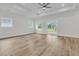 Bright and airy living room with ceiling fan and sliding door to the backyard at 3218 Pinewood Dr, Ladson, SC 29456