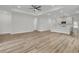 Living room with a tray ceiling, recessed lights, and wood floors, with an open floor plan at 3218 Pinewood Dr, Ladson, SC 29456