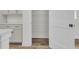 Modern kitchen pantry with wire shelving and a white shaker door at 3218 Pinewood Dr, Ladson, SC 29456