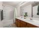 Double vanity bathroom featuring a bath and shower and warm wooden cabinets at 333 Flyway Rd, Goose Creek, SC 29445