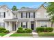 Charming townhouse featuring neutral siding, black shutters, and manicured landscaping for inviting curb appeal at 333 Flyway Rd, Goose Creek, SC 29445