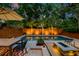 Stunning backyard oasis featuring a swimming pool, hot tub, fire pit, and comfortable seating area at 340 President St, Charleston, SC 29403