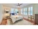 Cozy bedroom featuring a ceiling fan, plantation shutters and neutral decor at 340 President St, Charleston, SC 29403
