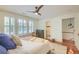 Comfortable bedroom with ceiling fan and view to ensuite bathroom at 340 President St, Charleston, SC 29403