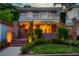 An exterior view of a brick two-story home featuring a white balcony with greenery at 340 President St, Charleston, SC 29403