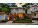 Charming two-story brick home with a lovely balcony, manicured landscaping, and inviting curb appeal on a sunny day at 340 President St, Charleston, SC 29403