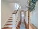 Welcoming foyer with hardwood floors, stairs, a blue runner, and decorative wreath at 340 President St, Charleston, SC 29403
